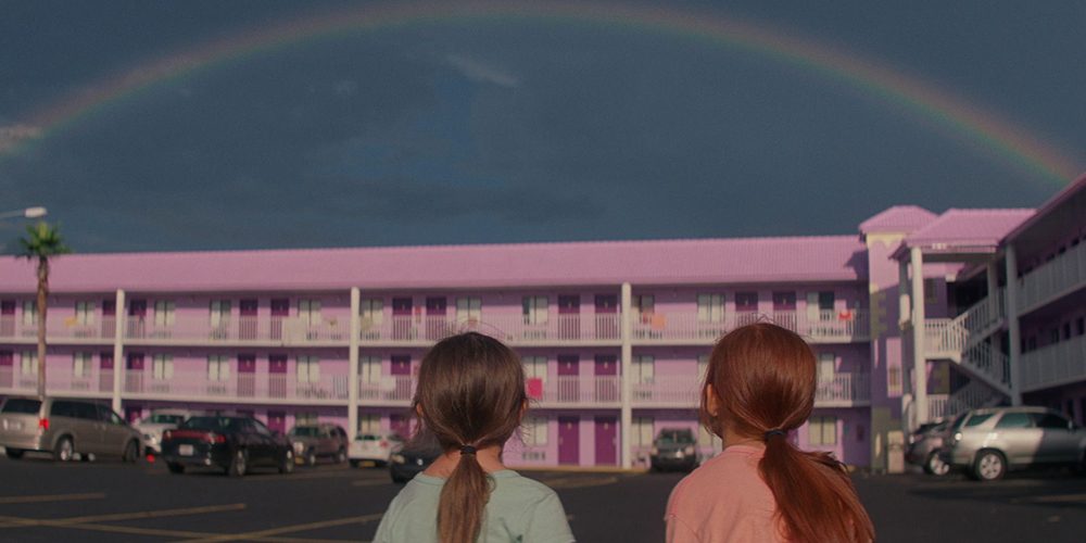 Halley and Jancey looking at a rainbow over the Magic Castle Motel
